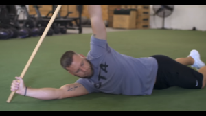 Athlete Performs thoracic rotations