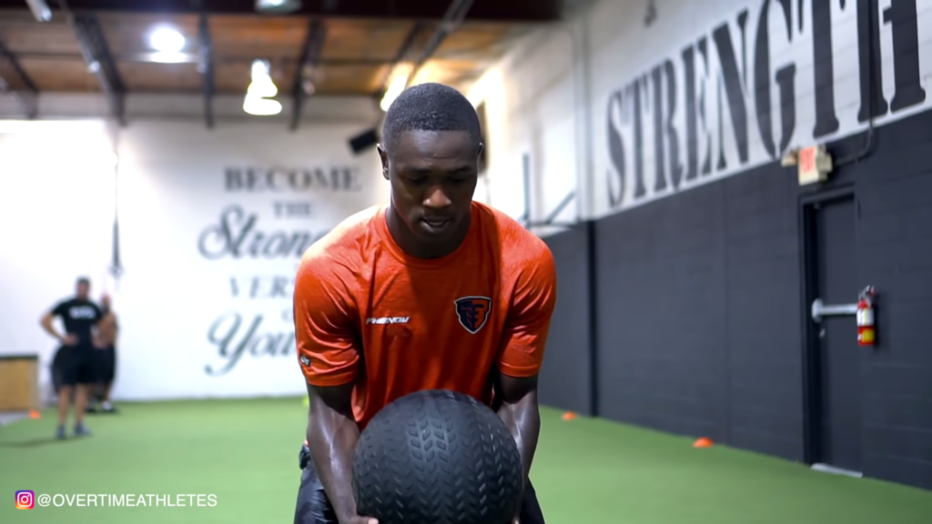 Football Player Performs Med Ball Power Toss