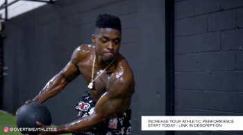 Football Player Performs Med Ball Twist