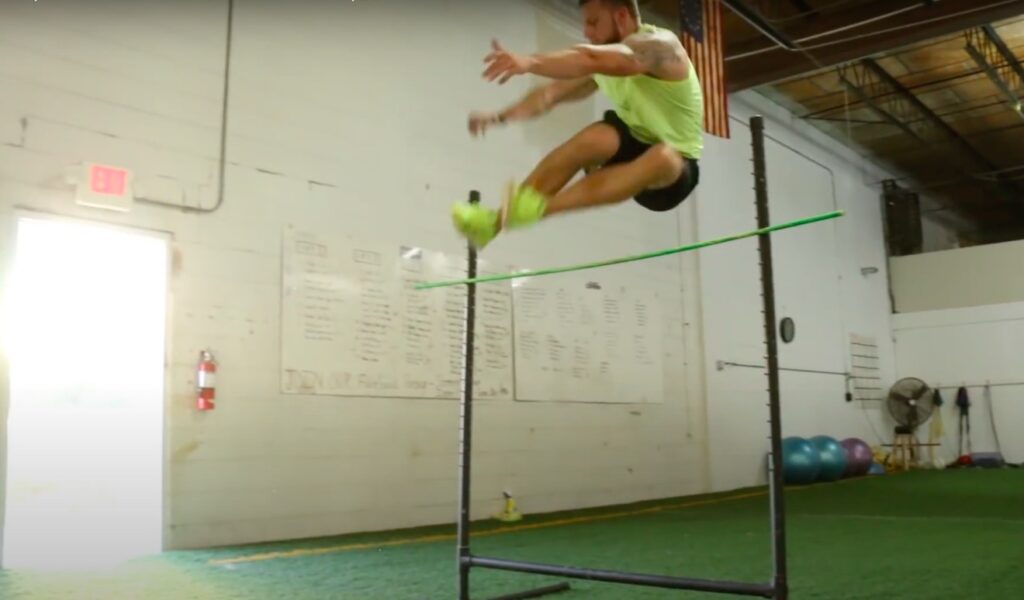 Athlete Performs Hurdle Jump to Build Explosiveness