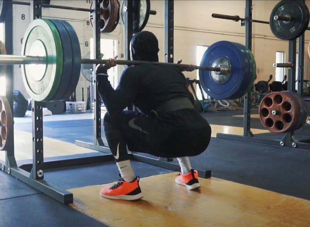 Athlete Performs Back Squat For Strength