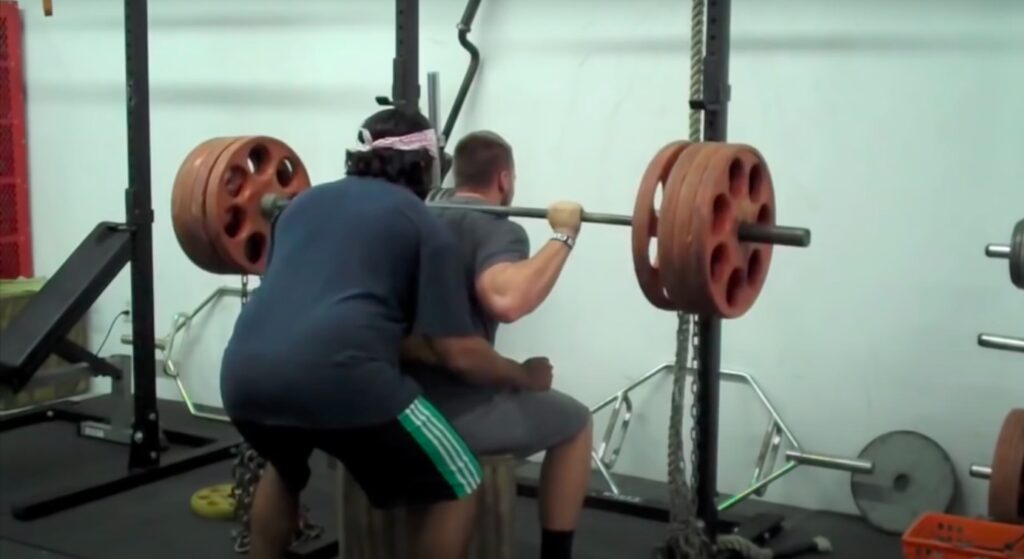 Athlete Performs Box Squat for Strength Gains