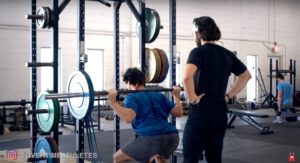 Athlete Performs Banded Squat