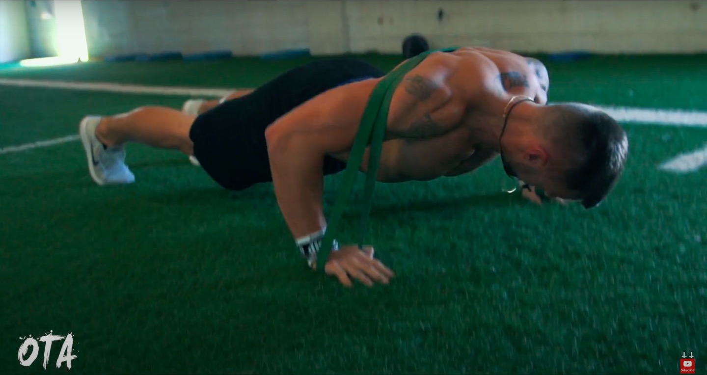 Athlete Performs Resistance Band Pushups