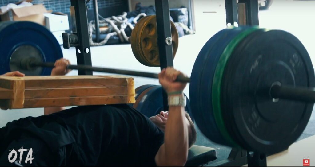 Athlete Performs Board Press