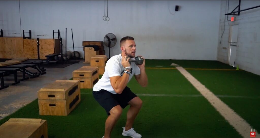 Athlete Performs Squat Drop with Resistance