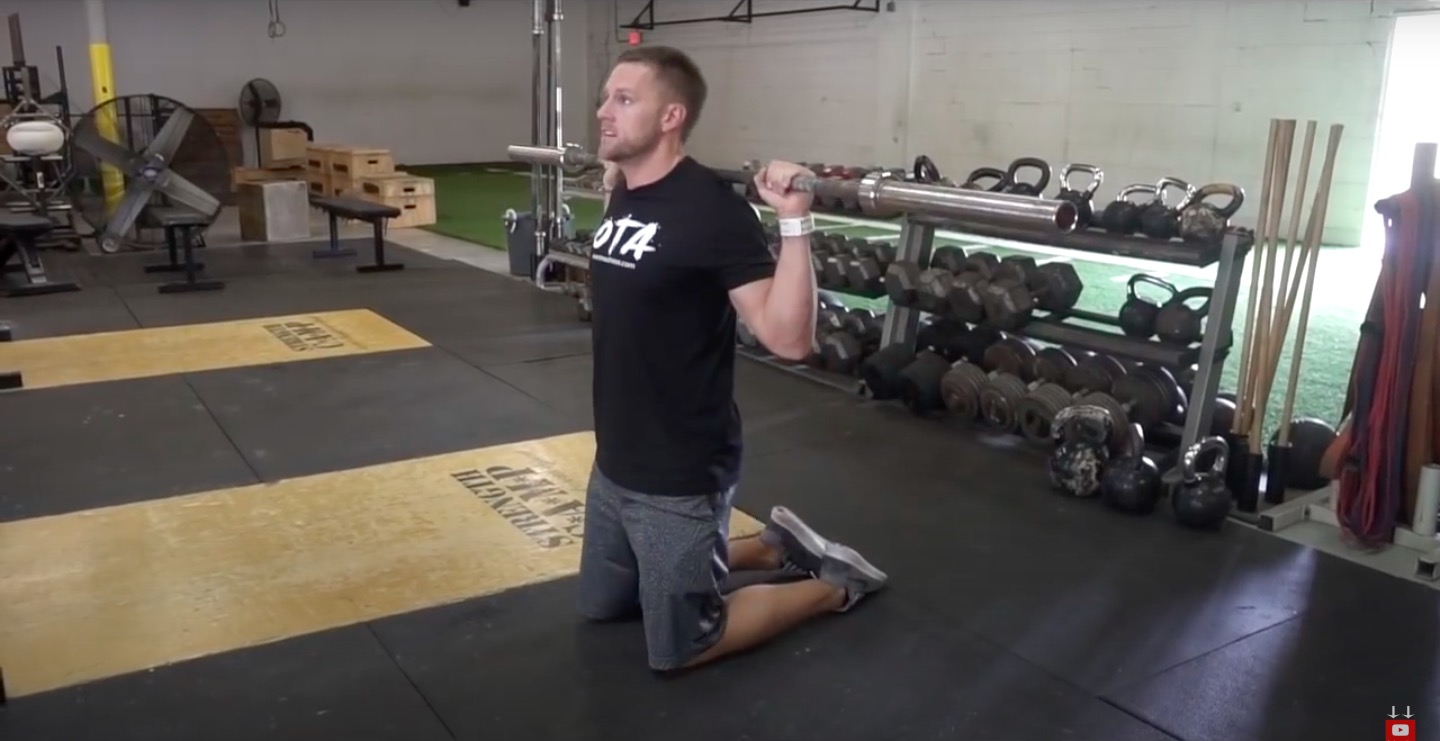 Athlete Performs Kneeling Squat