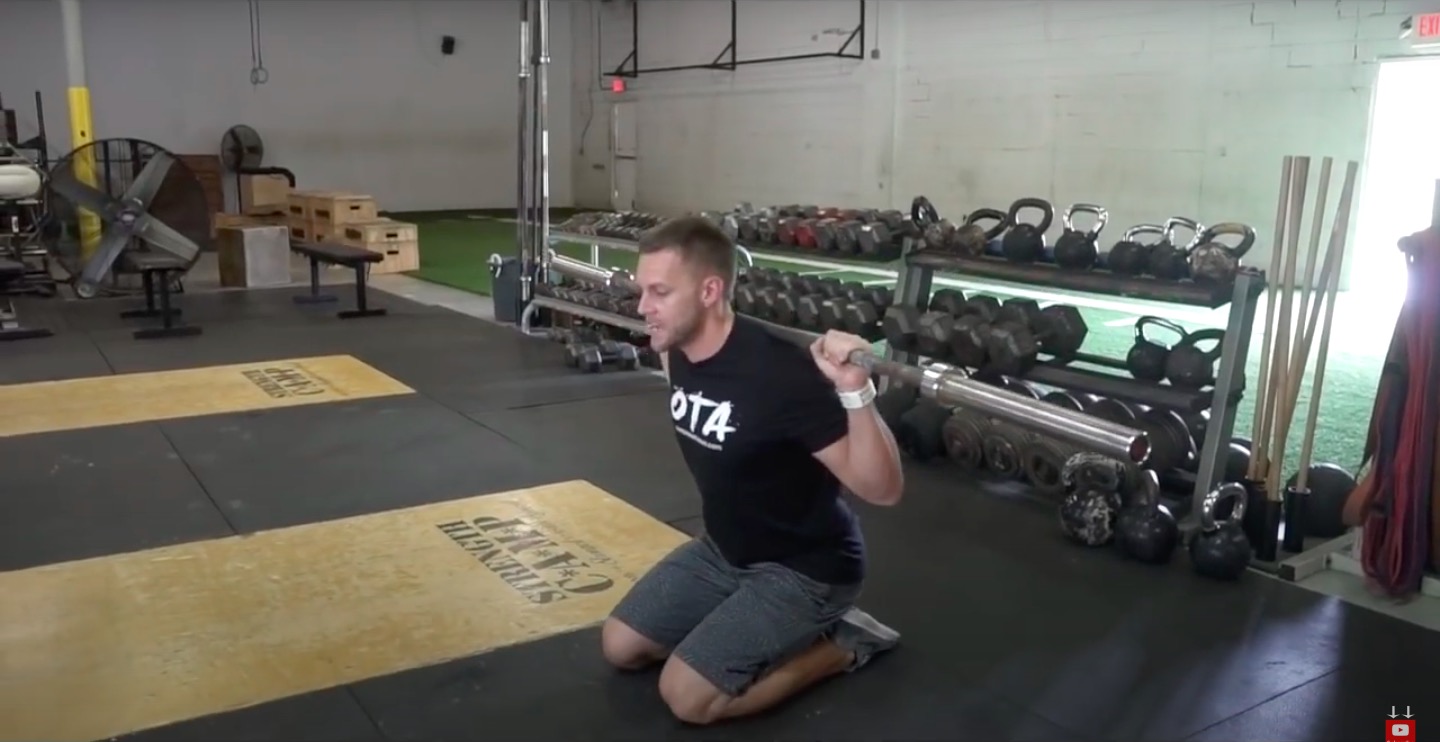 Athlete Performs Kneeling Squat