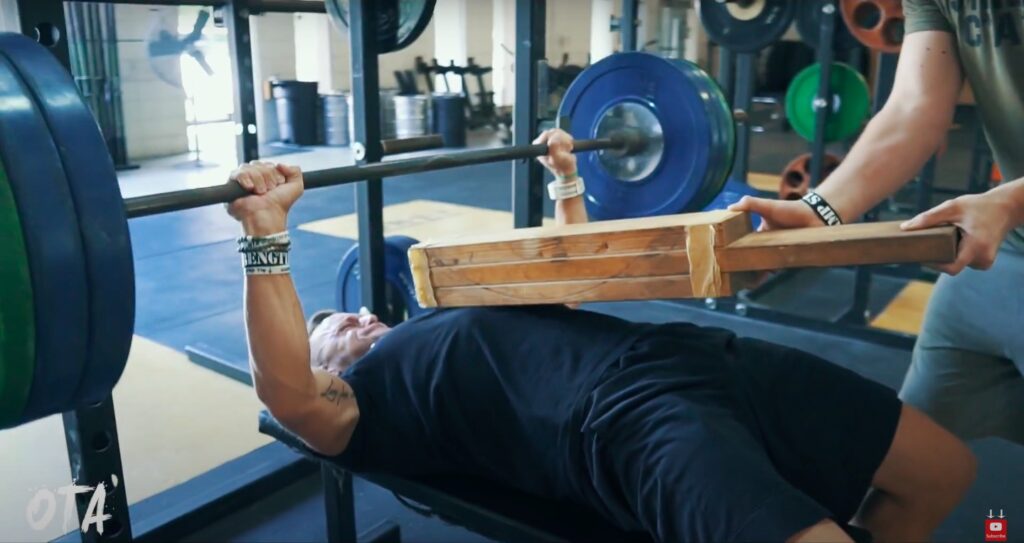 Athlete Performs Board Press