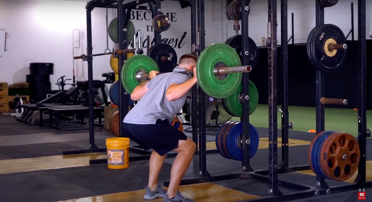 Athlete performs back squat