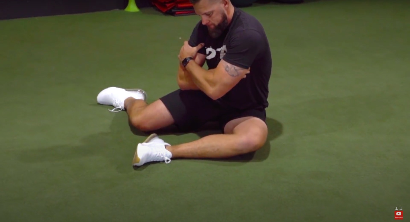 Athlete Performs Hip Mobility Drill 