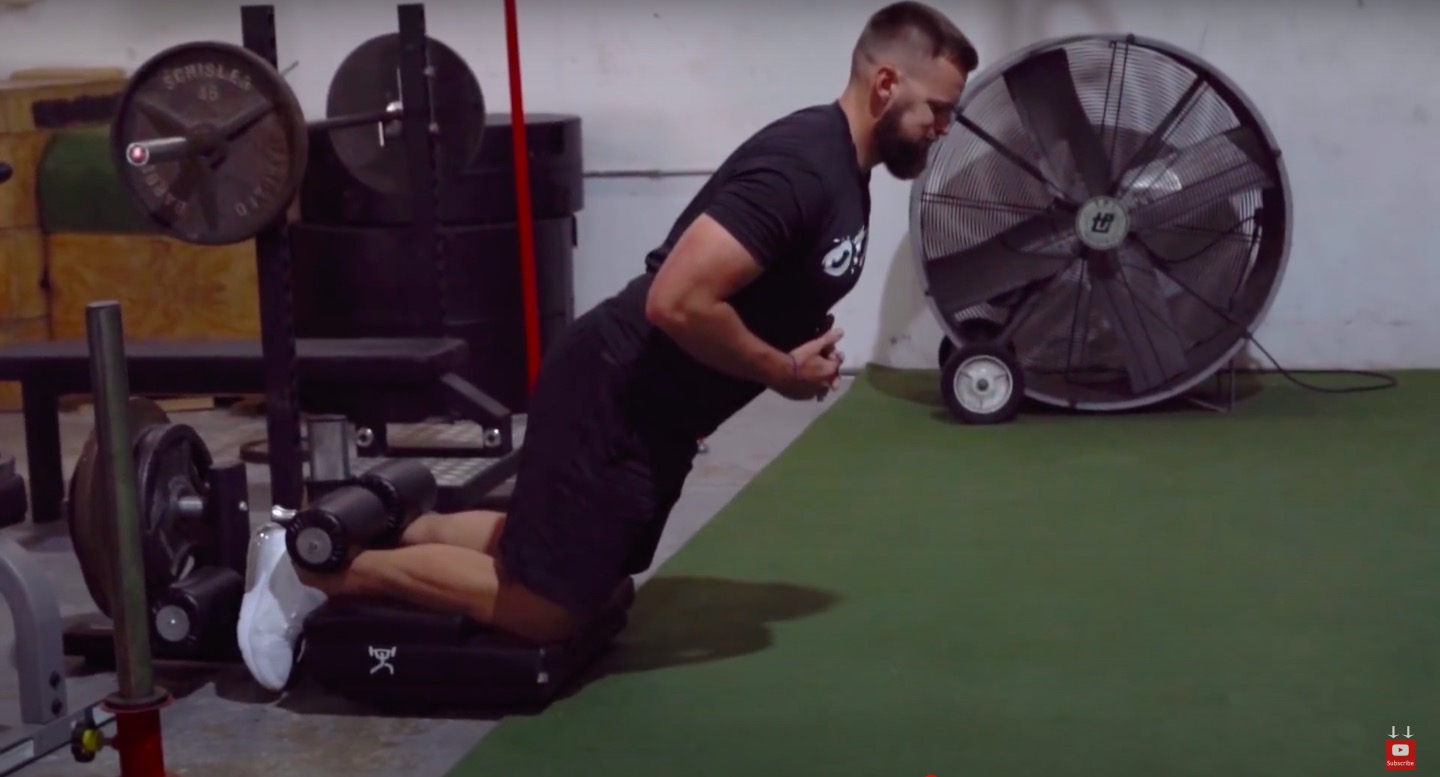 Athlete Performs Hamstring Curls