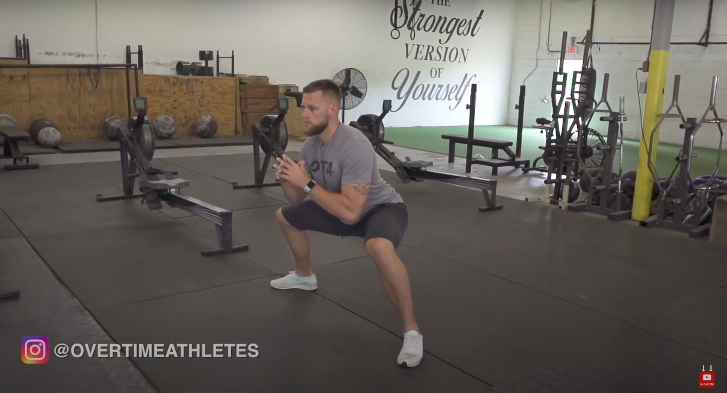 Athlete Performs wide squat