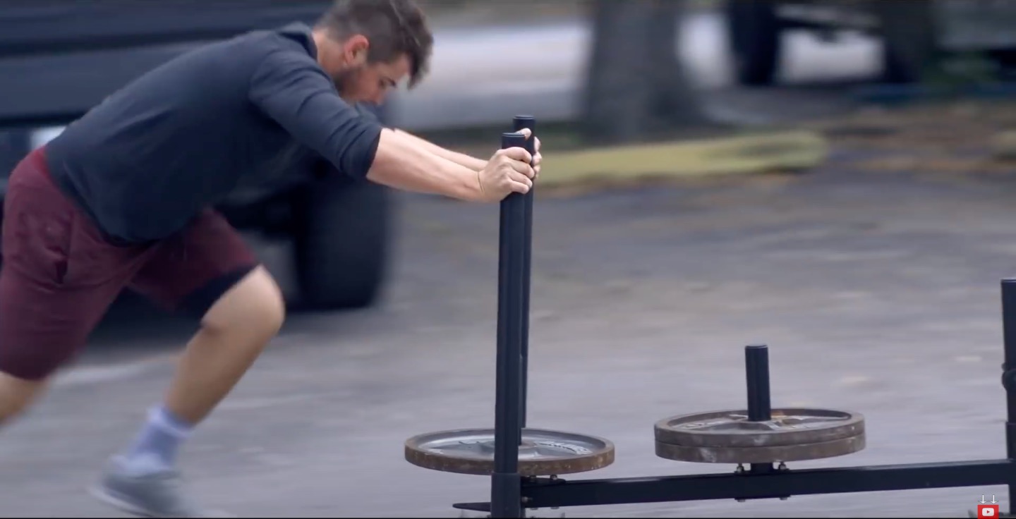 Athlete Performs Sled Push