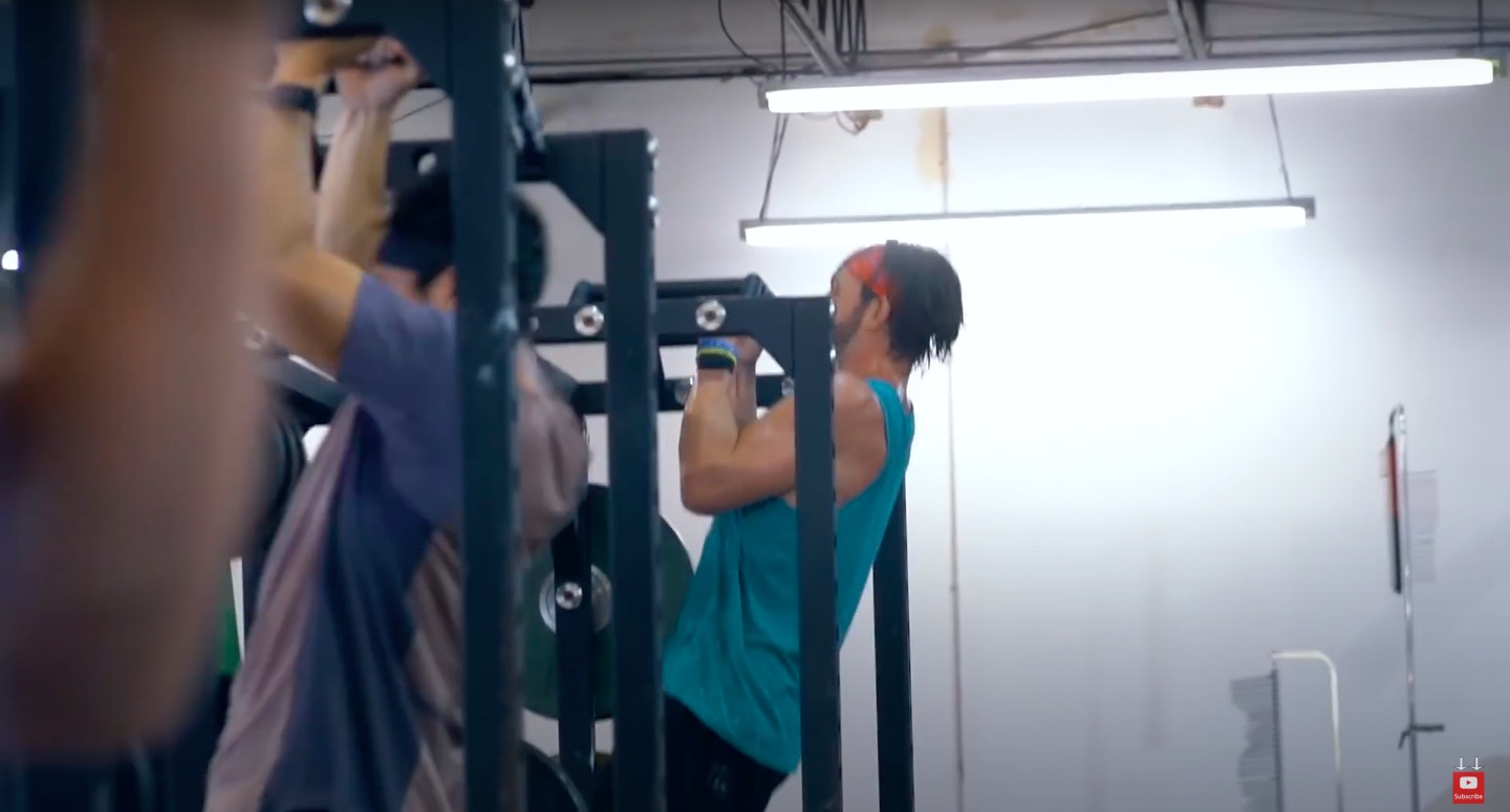 Athlete Performs natural grip pull ups