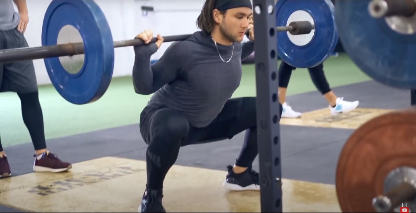 Athlete Performs back squat