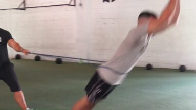 Athlete Performs Resisted Broad Jump